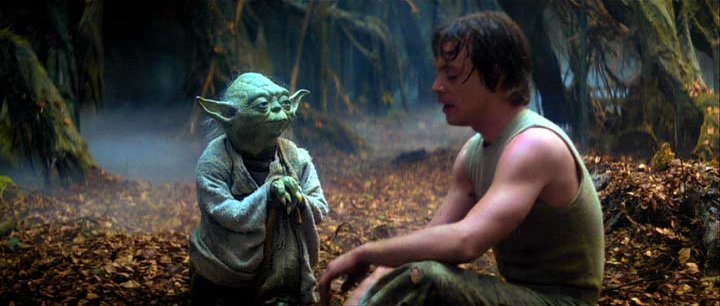 Luke training with Yoda.